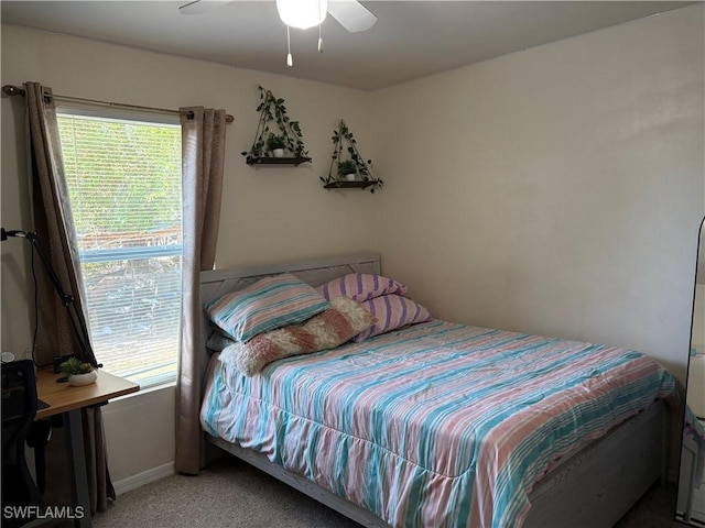 bedroom with ceiling fan and carpet