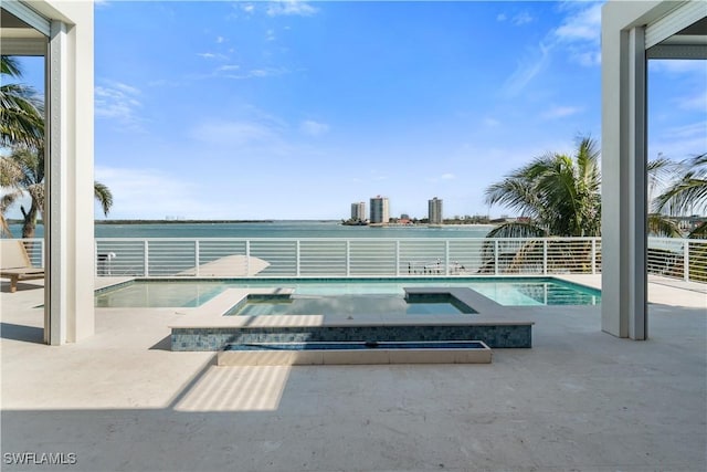 view of pool featuring an in ground hot tub and a patio area