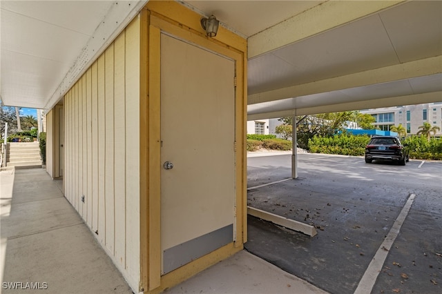 entrance to property featuring covered parking