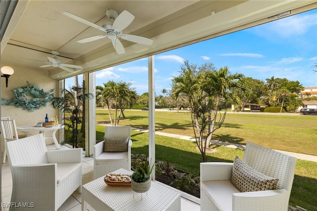 sunroom featuring ceiling fan