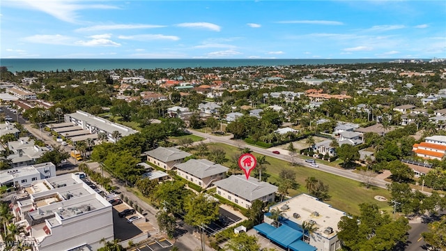 bird's eye view with a water view and a residential view