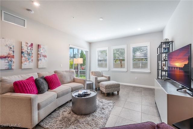 living room with light tile patterned floors, baseboards, visible vents, and recessed lighting