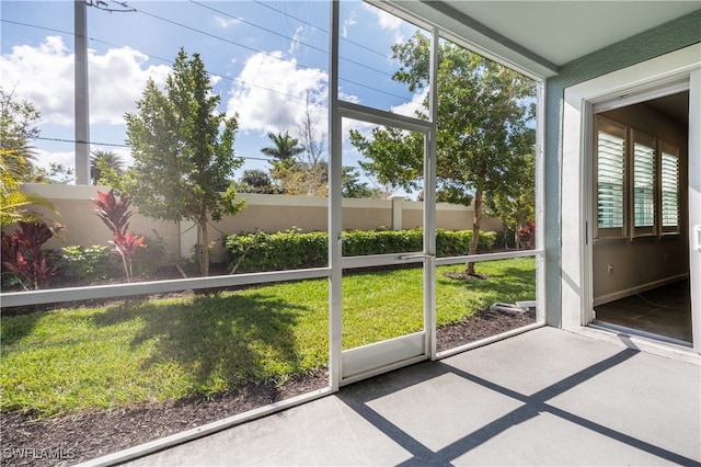 unfurnished sunroom featuring a wealth of natural light