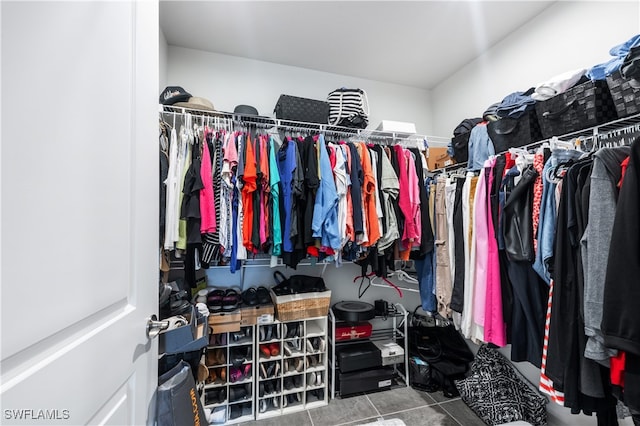 walk in closet featuring tile patterned flooring