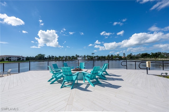 view of patio featuring a fire pit and a wooden deck