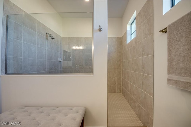 bathroom with a tile shower