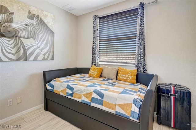 bedroom featuring light wood-type flooring