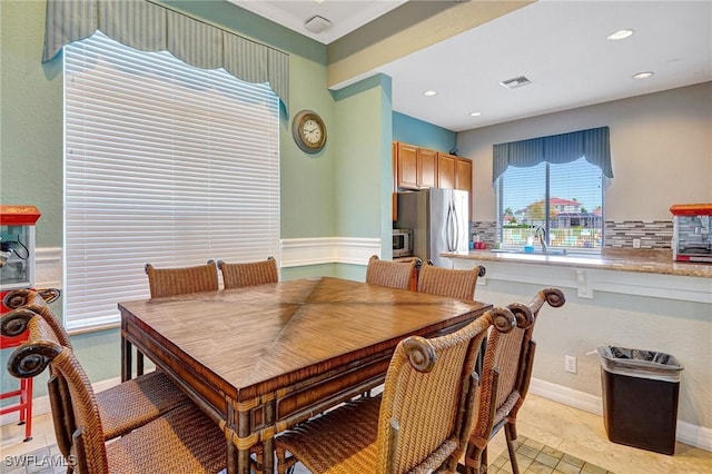 dining room featuring sink