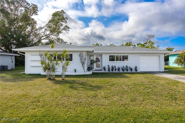 ranch-style house with a garage, a front yard, and central air condition unit