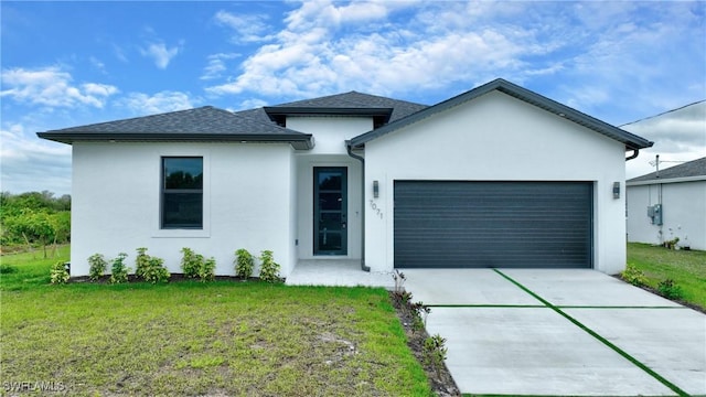 view of front of property featuring stucco siding, an attached garage, concrete driveway, and a front yard