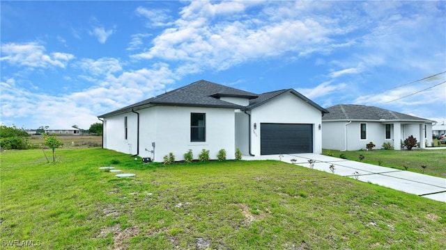 view of front of house featuring a front lawn, concrete driveway, a garage, and stucco siding