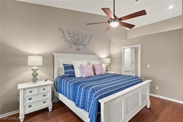 bedroom with a ceiling fan, baseboards, and wood finished floors