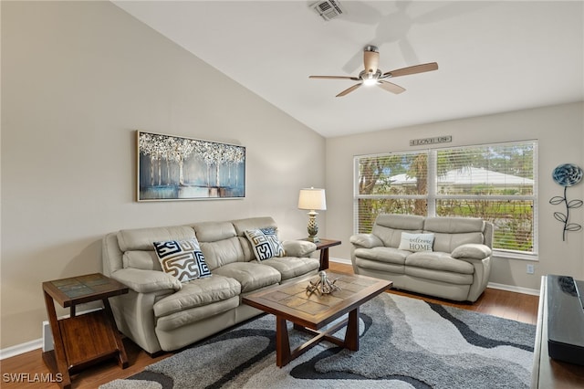 living area with baseboards, visible vents, lofted ceiling, ceiling fan, and wood finished floors