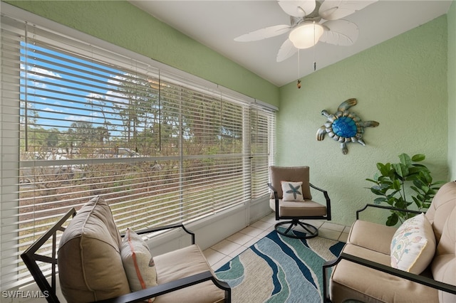 sunroom / solarium with a ceiling fan