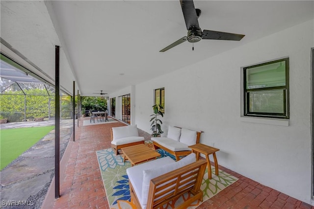 view of patio / terrace featuring a lanai, an outdoor hangout area, and ceiling fan