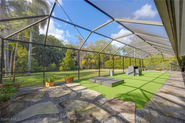 view of patio with glass enclosure