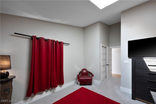 bedroom featuring light colored carpet