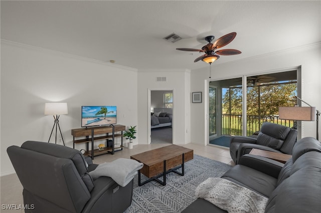 tiled living room with ornamental molding and ceiling fan