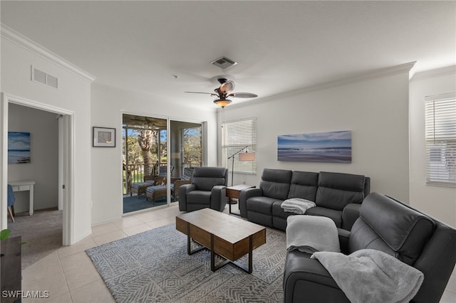 tiled living room featuring ceiling fan and ornamental molding