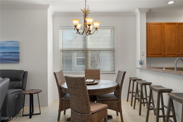 tiled dining space featuring crown molding and an inviting chandelier