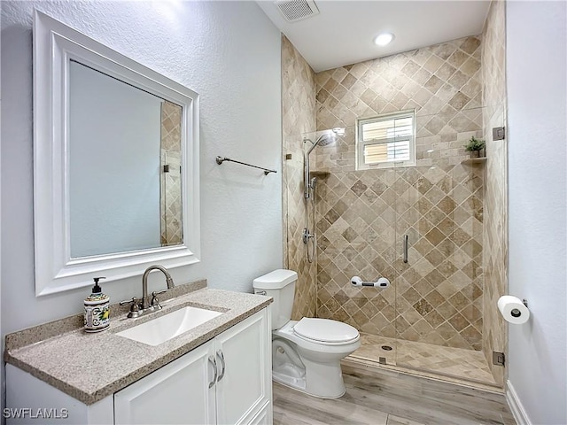 7684 County Rd 78, Fort Denaud, FL 33935 - bathroom featuring visible vents, toilet, vanity, and a shower stall