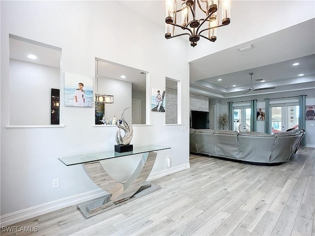 7684 County Rd 78, Fort Denaud, FL 33935 - living area with recessed lighting, a raised ceiling, light wood-style flooring, and baseboards