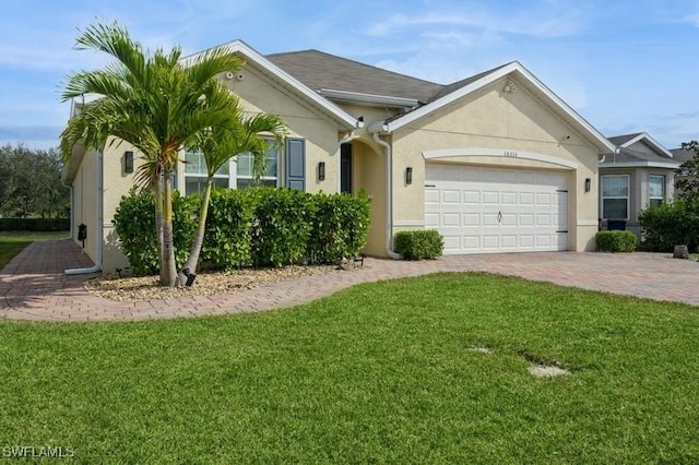 single story home featuring a garage and a front yard