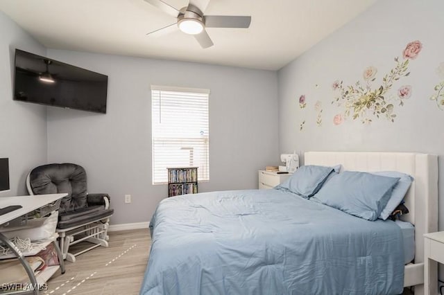 bedroom with ceiling fan and light hardwood / wood-style flooring