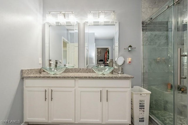 bathroom with vanity and walk in shower