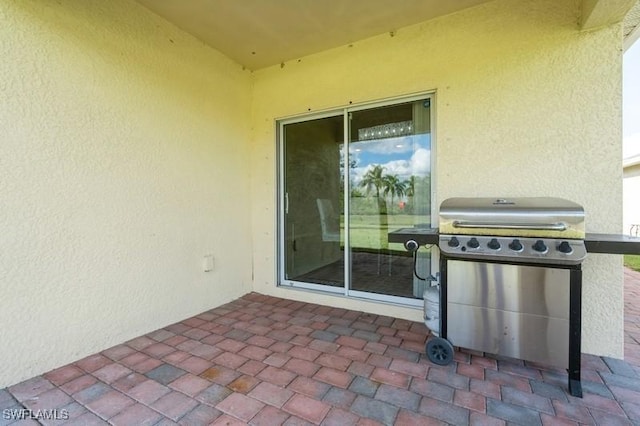 view of patio featuring a grill