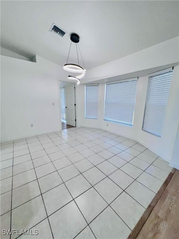 empty room with light tile patterned floors