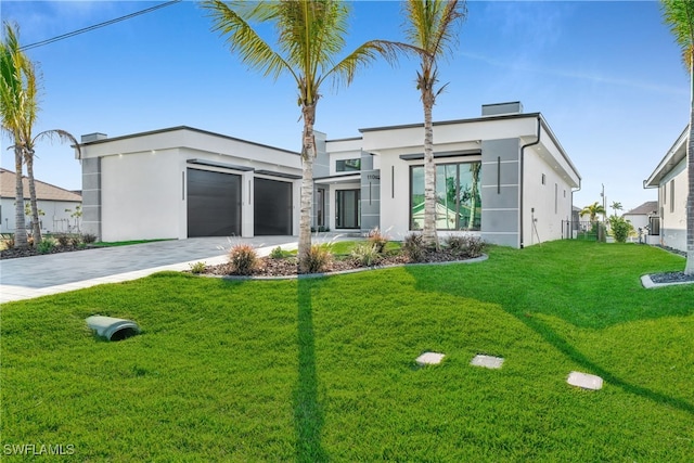 view of front facade with a garage and a front yard