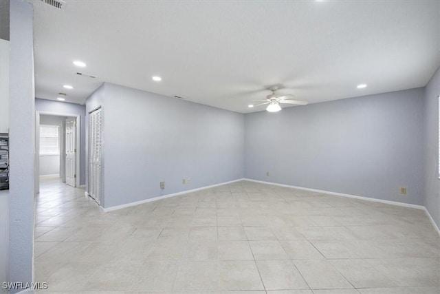 unfurnished room featuring light tile patterned floors and ceiling fan