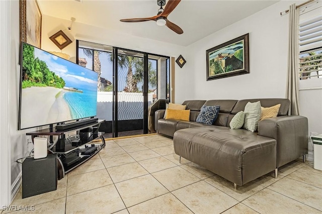 tiled living room featuring ceiling fan