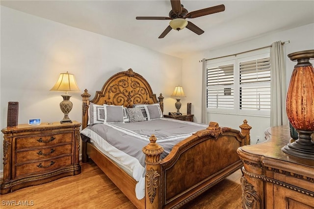 bedroom featuring hardwood / wood-style flooring and ceiling fan