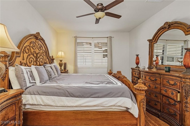 bedroom featuring ceiling fan and wood-type flooring