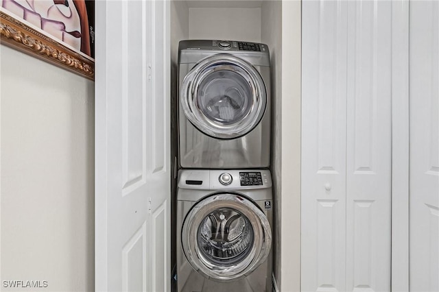 laundry room with stacked washer and clothes dryer