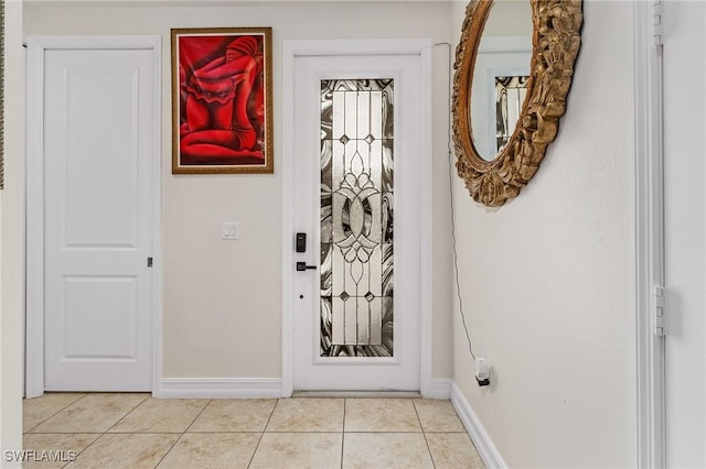 entryway with light tile patterned floors