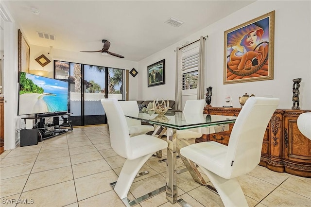 dining room with light tile patterned floors and ceiling fan