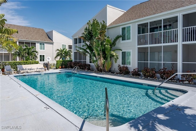 view of pool featuring a patio