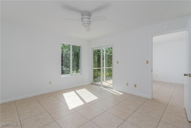 unfurnished room featuring ceiling fan and light tile patterned floors