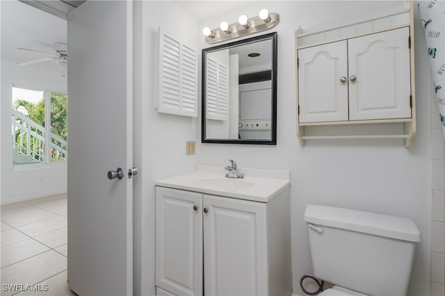 bathroom with vanity, ceiling fan, tile patterned floors, and toilet