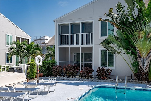 view of swimming pool featuring a patio area