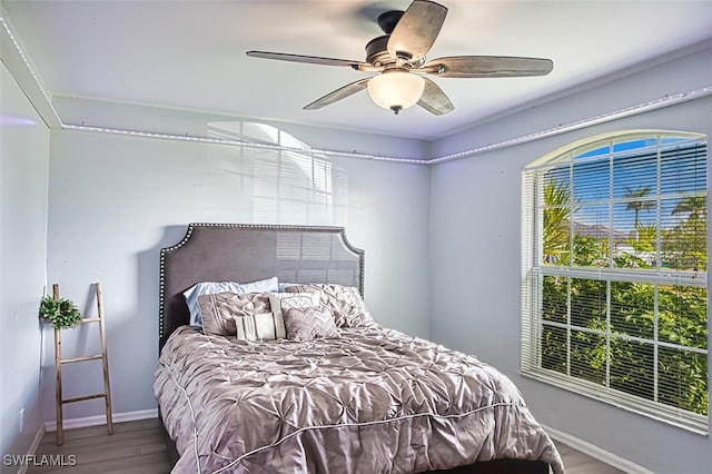 bedroom featuring hardwood / wood-style flooring and ceiling fan