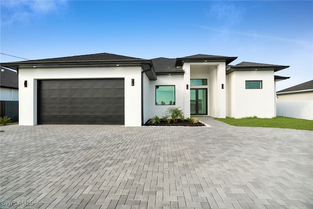 2125 Trafalgar Pkwy, Cape Coral, FL 33991 - view of front of property with decorative driveway, stucco siding, and a garage