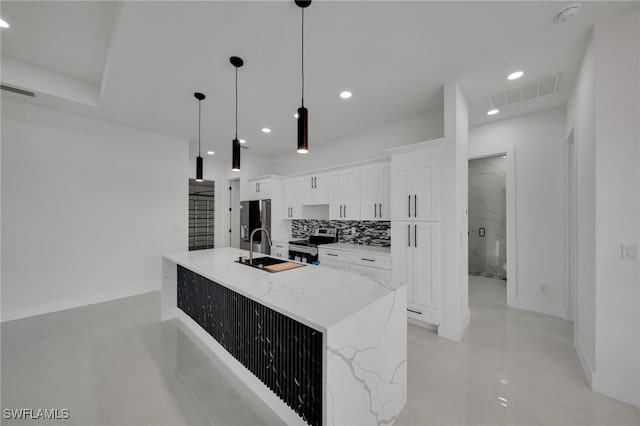 2125 Trafalgar Pkwy, Cape Coral, FL 33991 - kitchen featuring stainless steel appliances, white cabinets, a spacious island, recessed lighting, and decorative backsplash