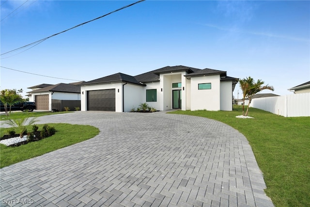 2125 Trafalgar Pkwy, Cape Coral, FL 33991 - prairie-style home with decorative driveway, an attached garage, and stucco siding