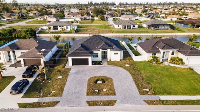 2125 Trafalgar Pkwy, Cape Coral, FL 33991 - aerial perspective of suburban area with a nearby body of water