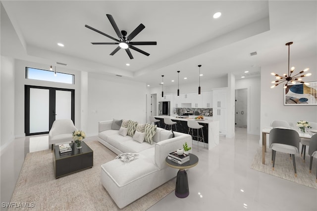 2125 Trafalgar Pkwy, Cape Coral, FL 33991 - living area with recessed lighting, a chandelier, a raised ceiling, baseboards, and a ceiling fan
