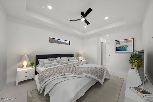 2125 Trafalgar Pkwy, Cape Coral, FL 33991 - bedroom with a tray ceiling, recessed lighting, ceiling fan, and baseboards